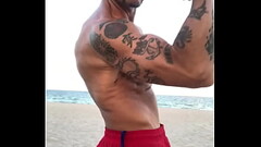 BICEP FLEXING  AT THE BEACH Thumb